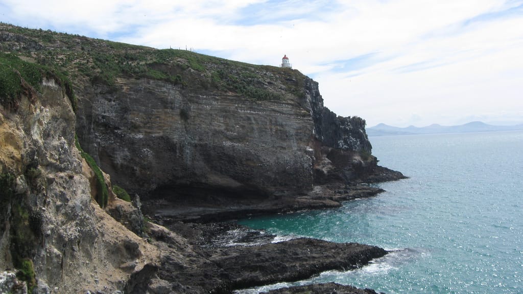 Lighthouse on a cliff overlooking the sea